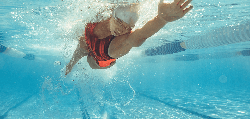 Woman Swimming in Pool